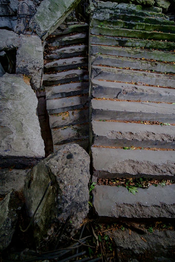Broken outdoor stairs representing an unsafe premises claim